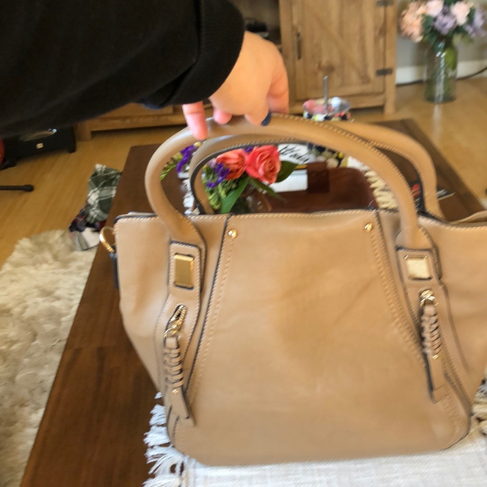Vegan purse strap inside.Tons of pocket space